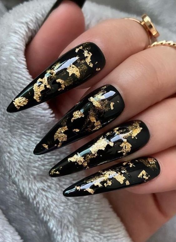 Black Stiletto Gold Flakes Nails