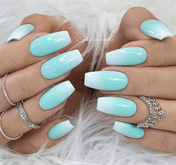 Artistic Teal and Rhinestone Nail Design